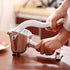 Presse fruits manuel en acier inoxydable - UstensilesCulinaires